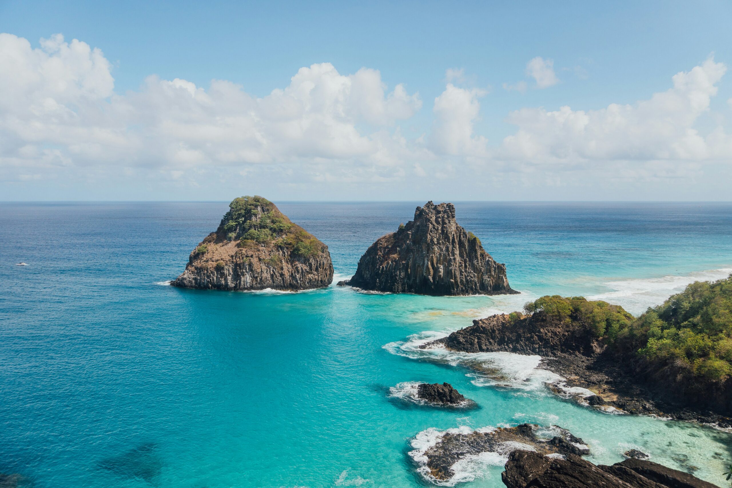 Honeymoon in Brazil: 5 Secluded Romantic Hideaways Baía do Sancho in Fernando de Noronha — turquoise water and cliffs, ideal for a honeymoon in Brazil